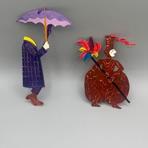 Pair of Vintage Judie Bomberger Metal Craft Art  Cirque Du Soleil Ornaments